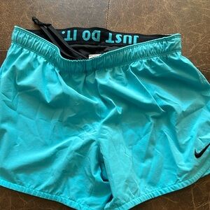 Nike Blue running shirt with built in liner Size S